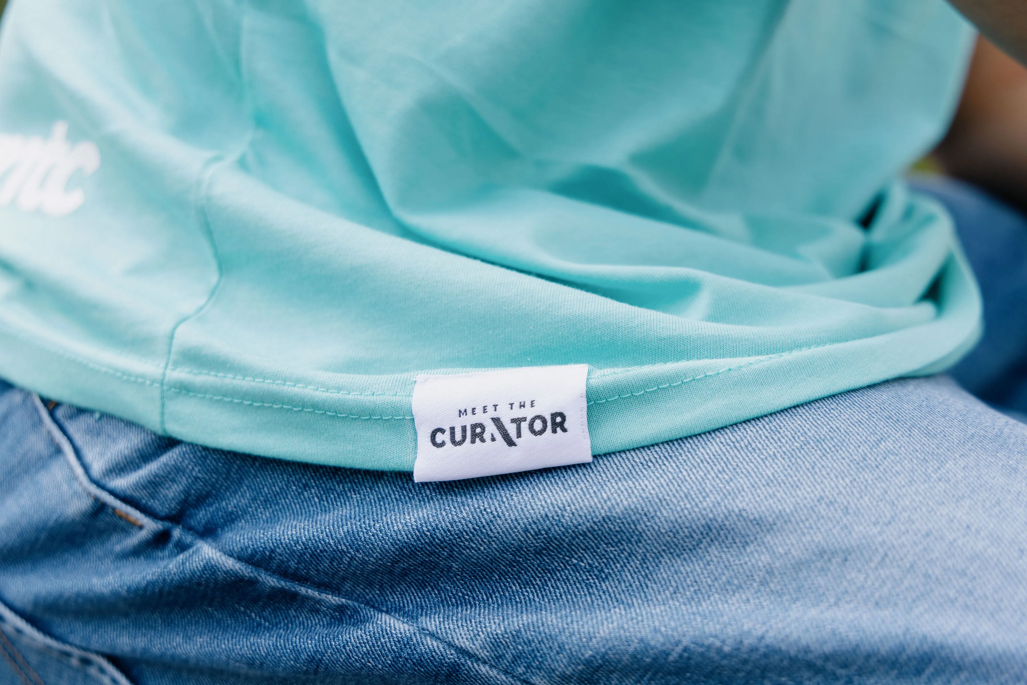 Meet The Curator - Big Face Logo